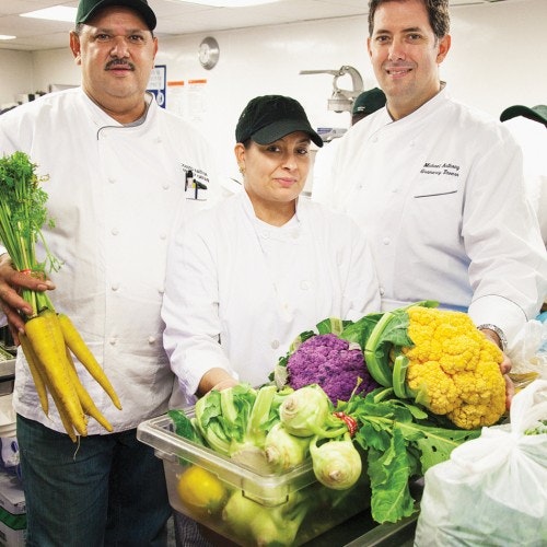 modesto-batista-with-his-wife-prep-chef-iris-batista-and-executive-chef-michael-anthony-in-the-prep-kitchen-at-gramerc