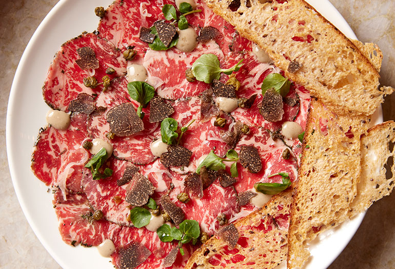 a plate of food with a slice of pizza