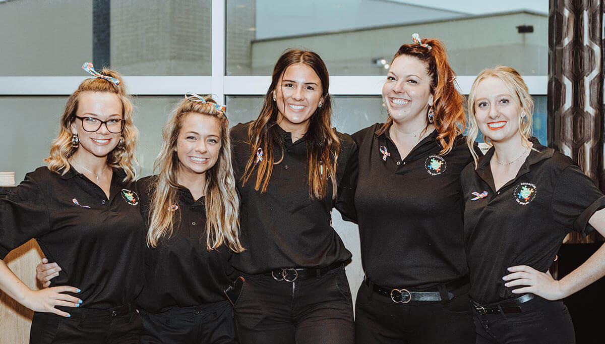 a group of people posing for the camera