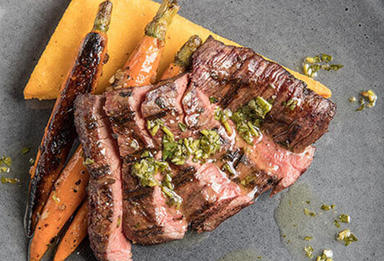 a sandwich with meat and vegetables