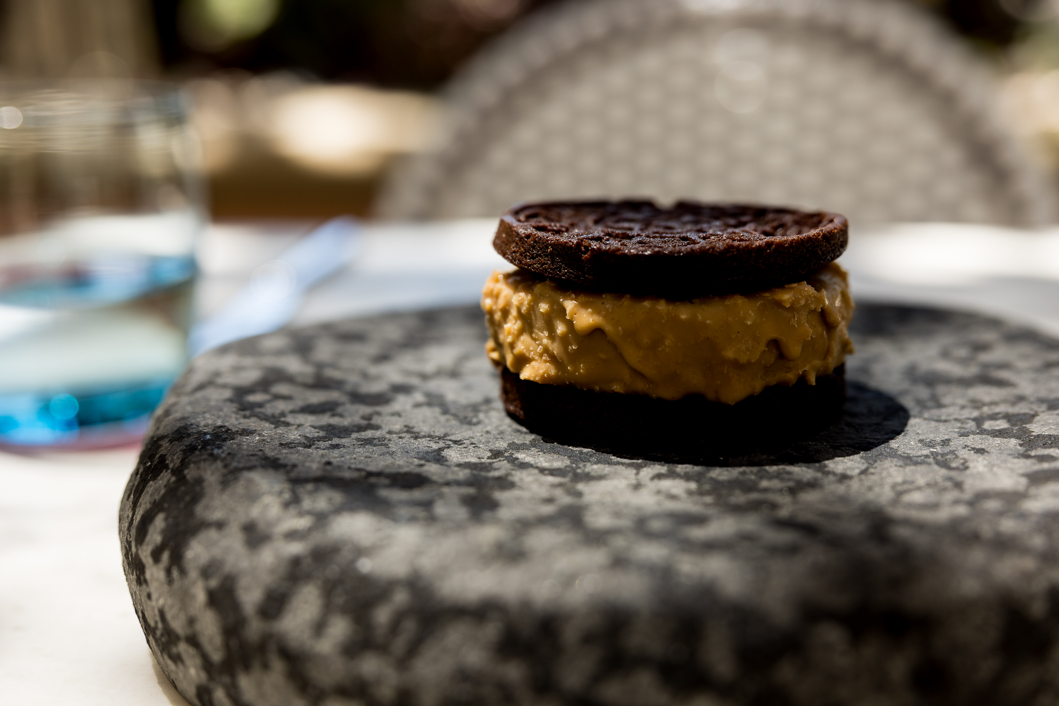a cookie sandwich on a stone surface