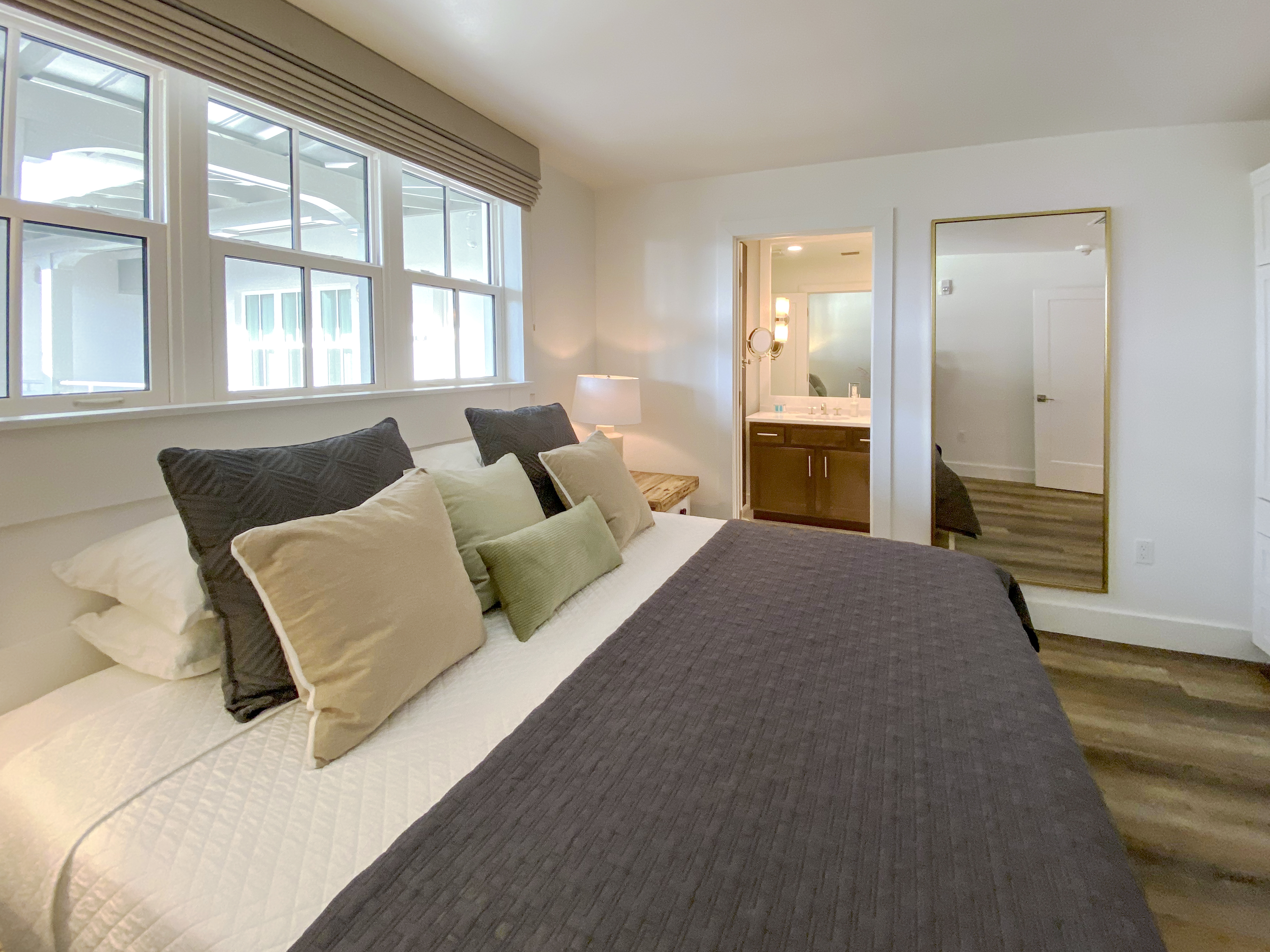 a bedroom with a large bed in a hotel room