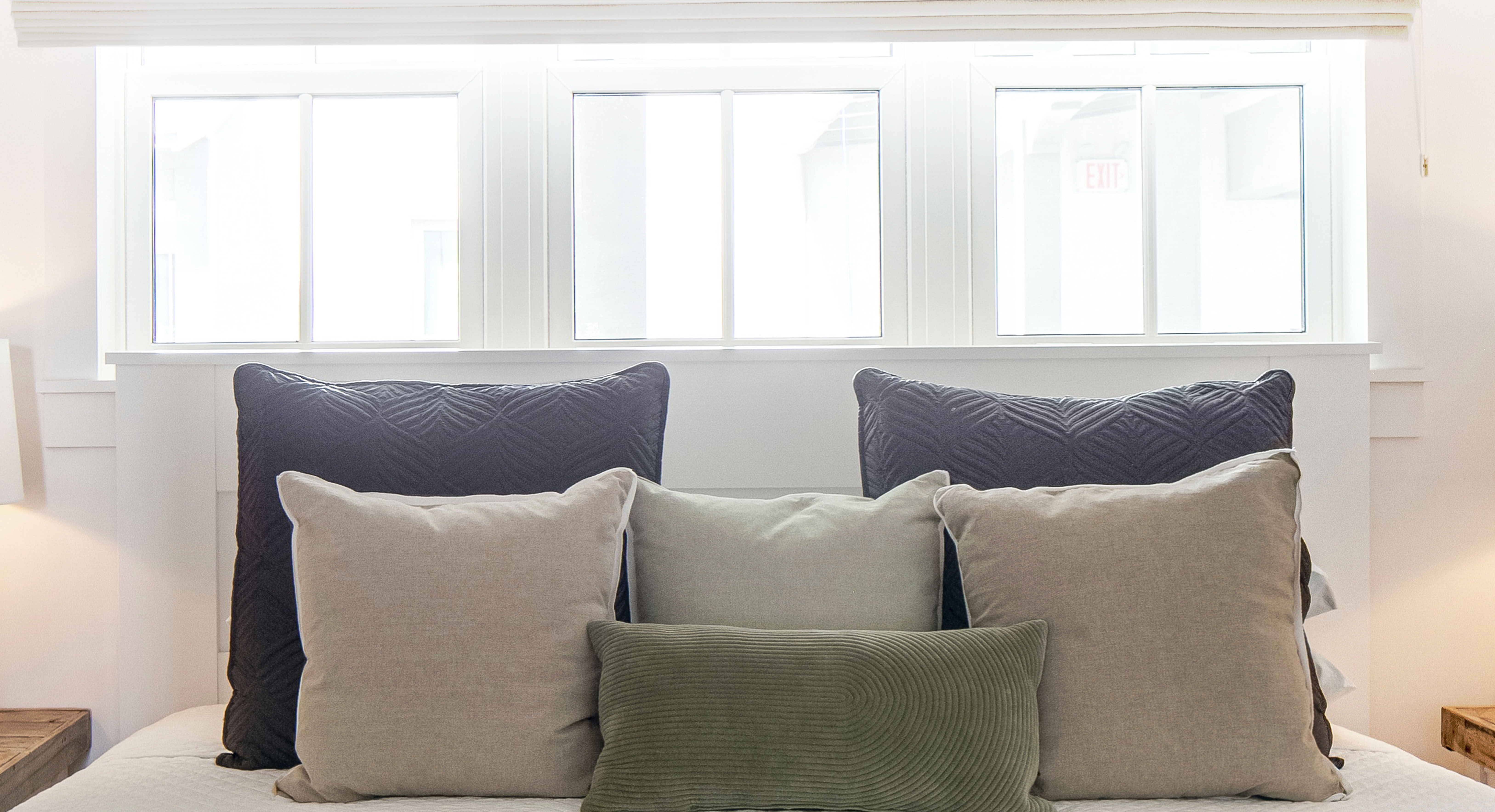 a living room filled with furniture and a large window