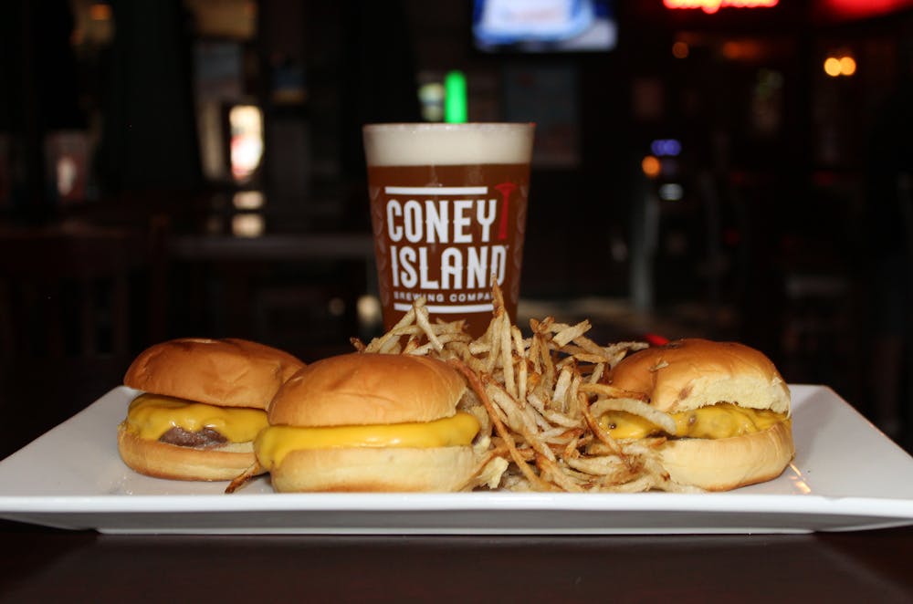 a close up of a sandwich and fries on a plate