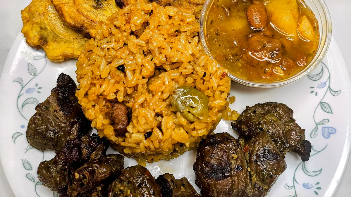 a plate of food with rice meat and vegetables