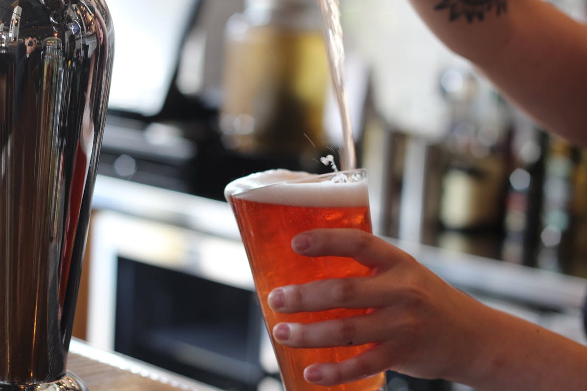 a close up of a person drinking from a cup