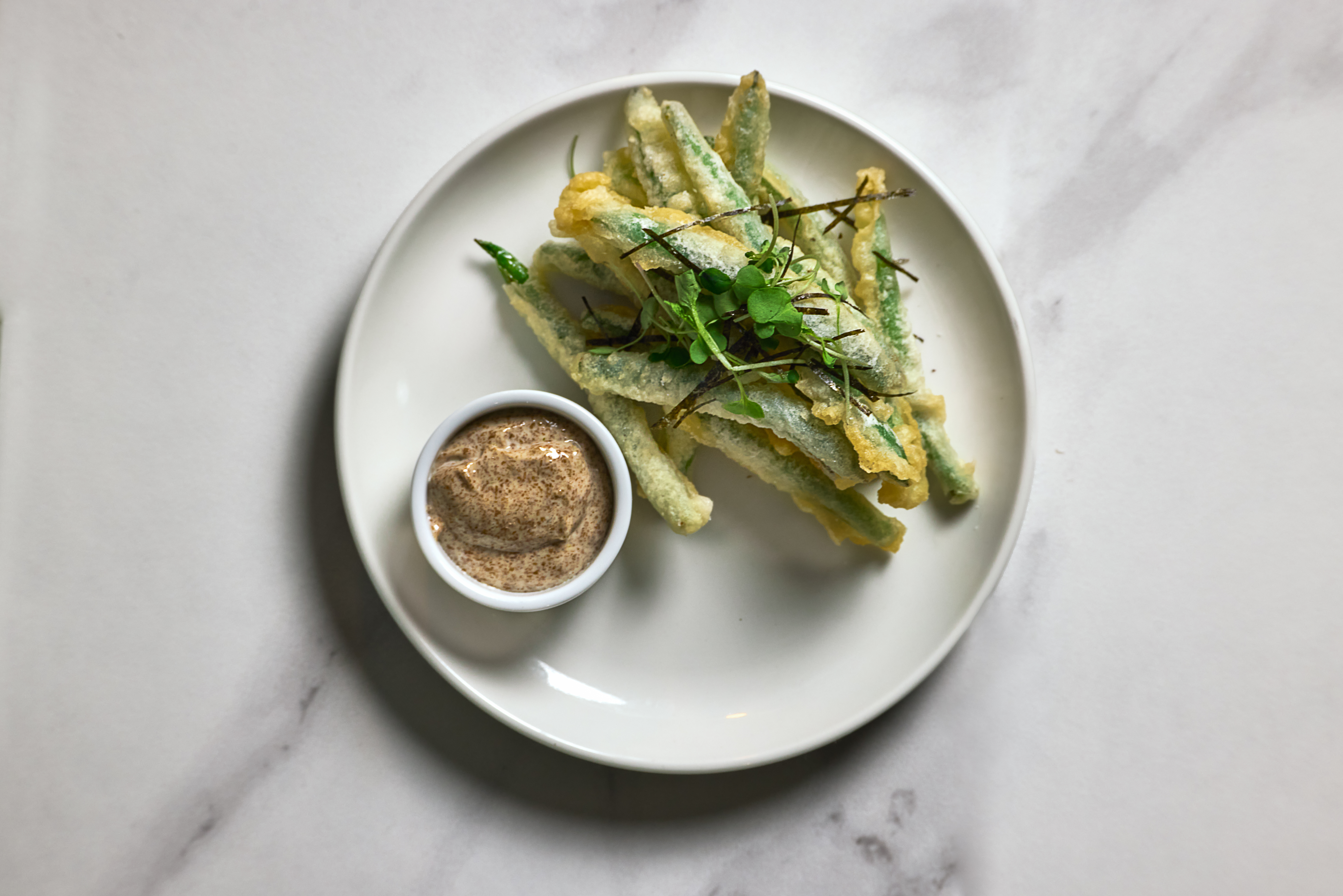 Bar Esper a plate of food on a marble surface