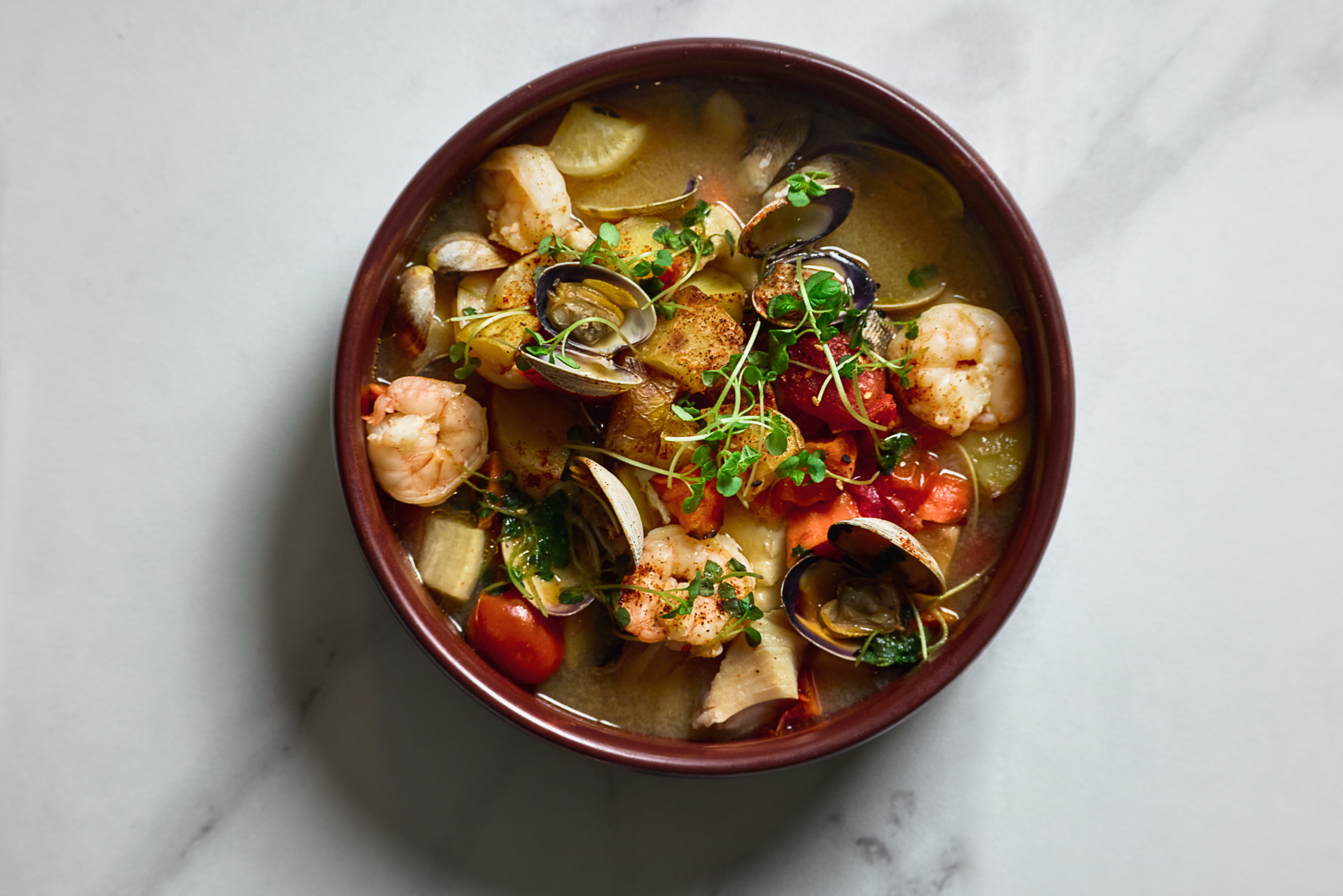 Bar Epser a bowl of soup with seafood
