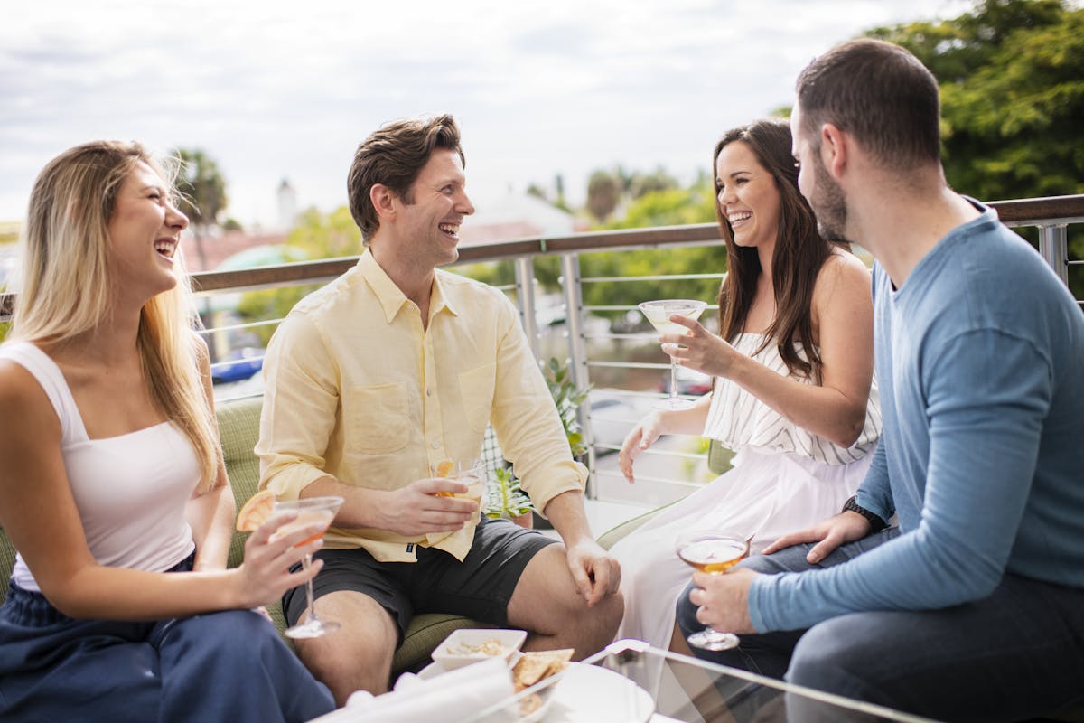 a group of people sitting on a bench