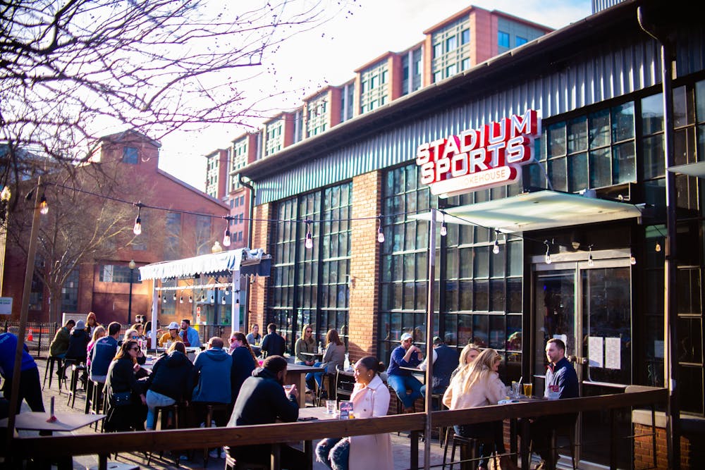 a group of people standing in front of a building