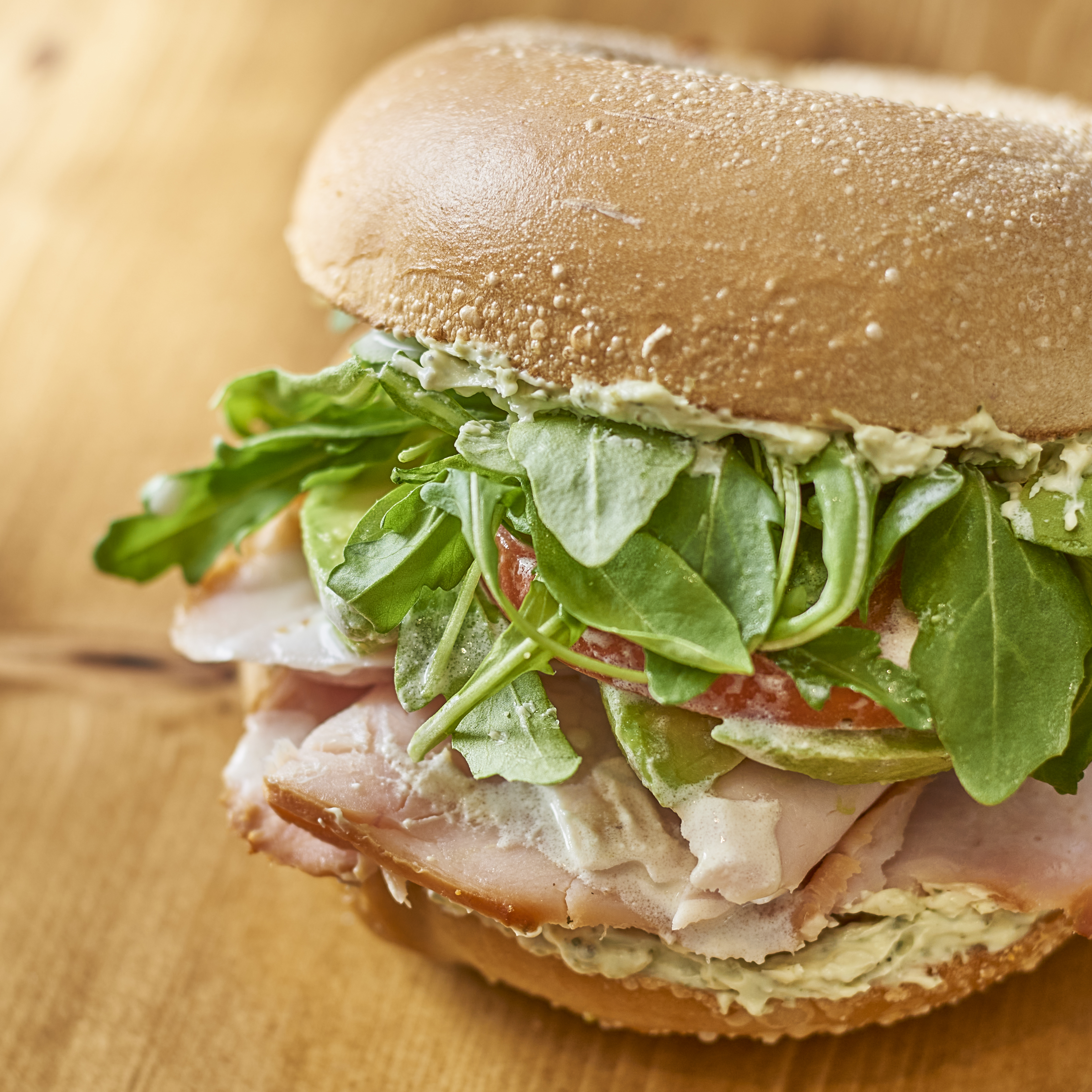 a sandwich on a wooden surface
