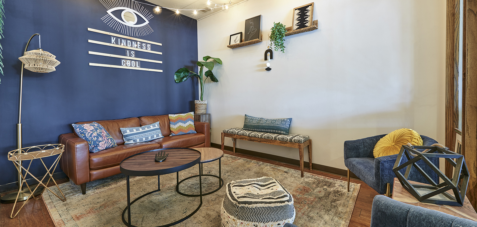 a living room filled with furniture and vase on a table