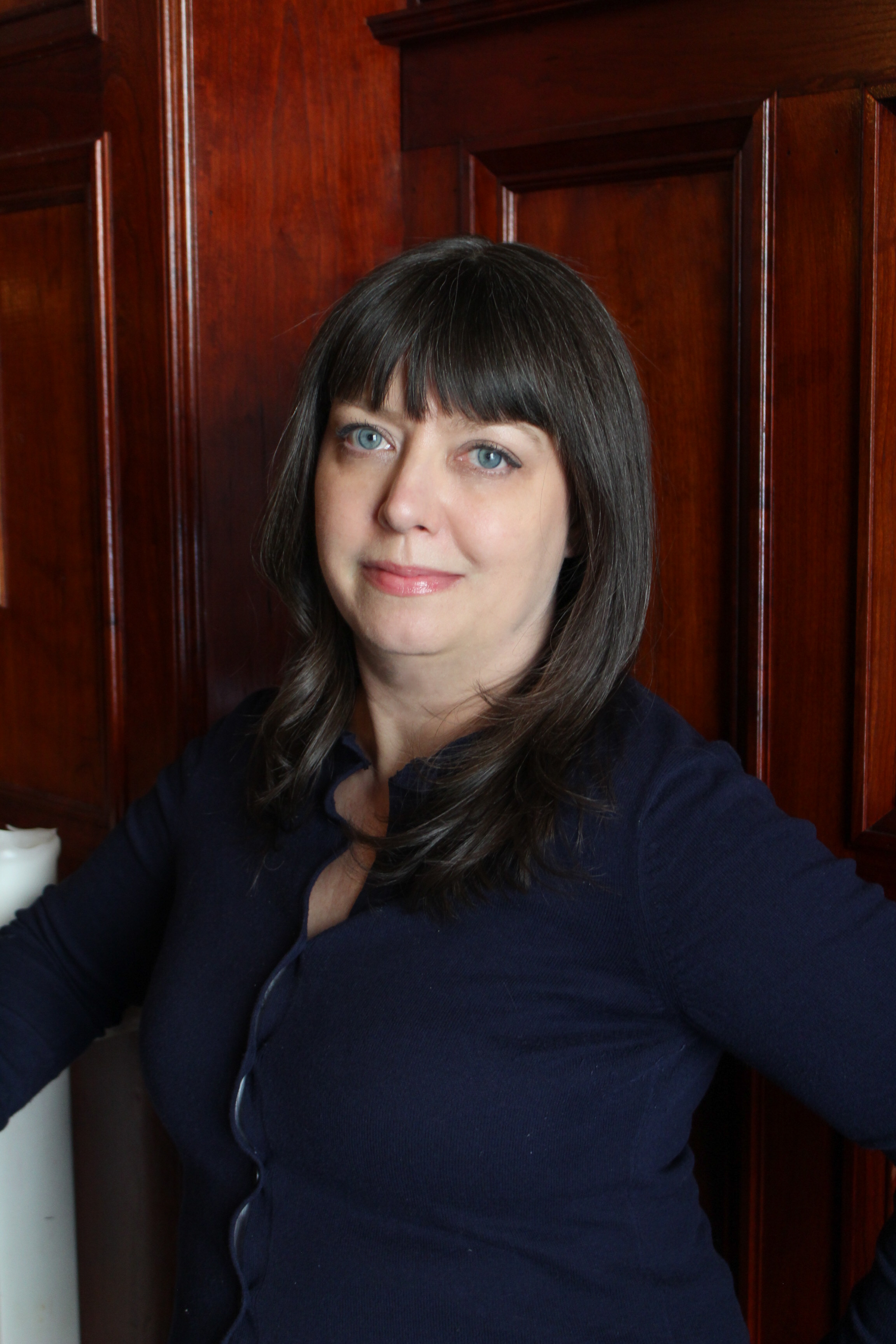 a woman with long hair and blue eyes