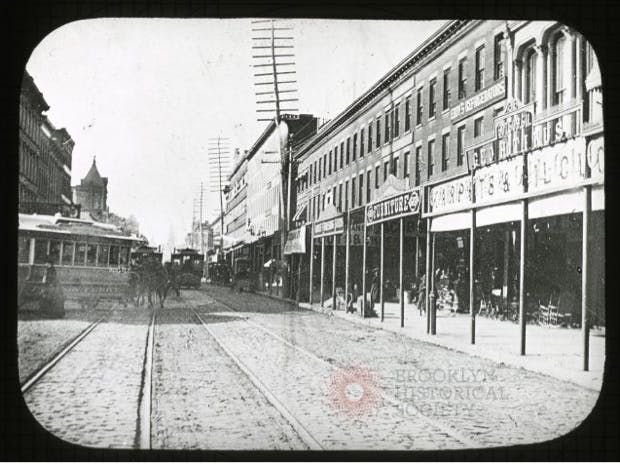 a black and white photo of a city street