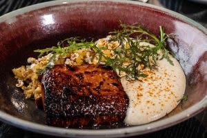 a bowl filled with meat and vegetables
