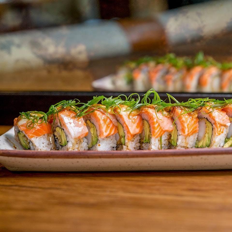 a tray of food on a wooden table