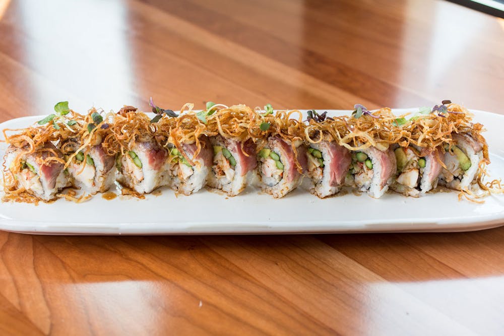 a plate of food on a wooden table