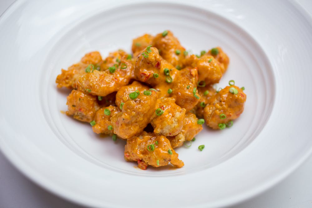 a plate of food with meat and vegetables