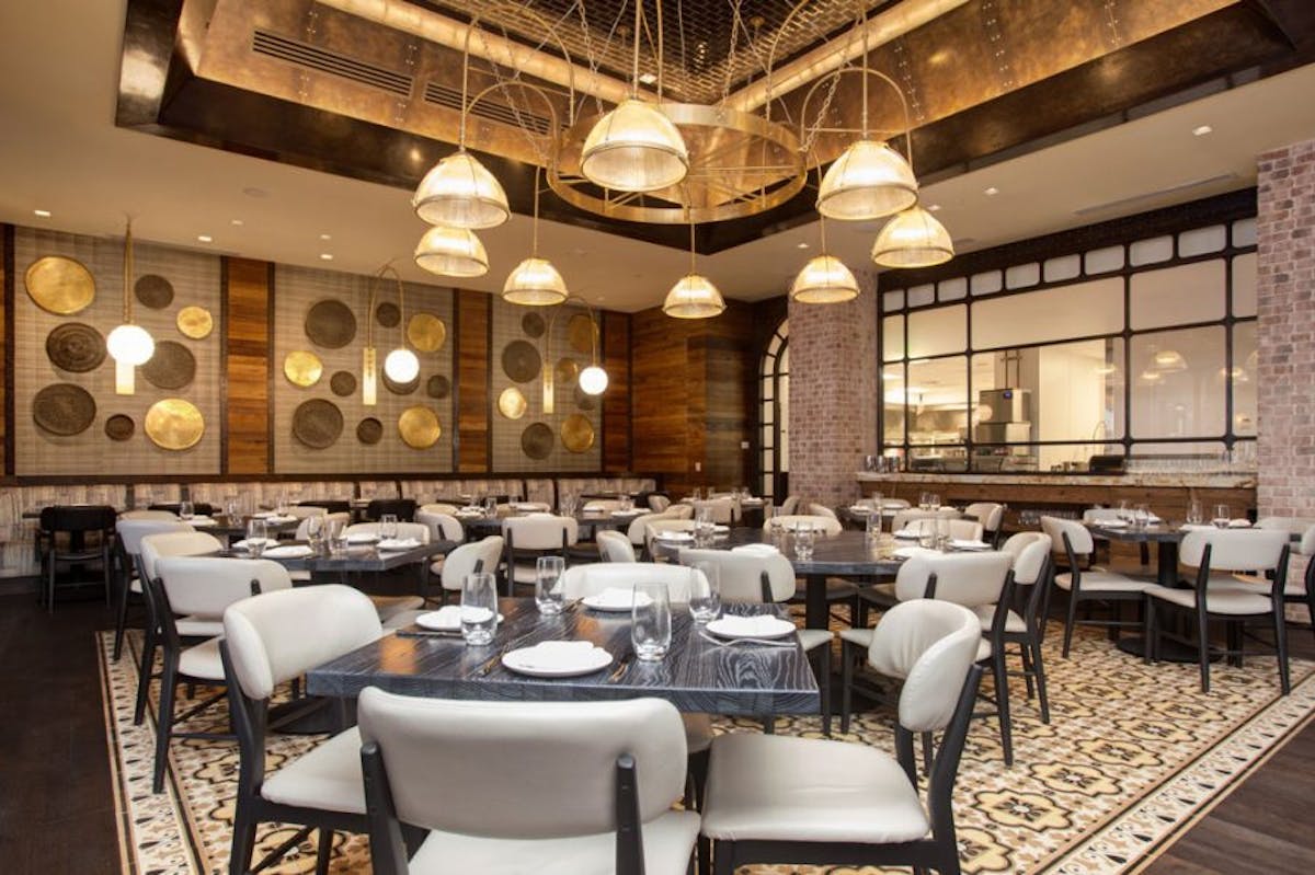 a room filled with furniture and a table in a restaurant