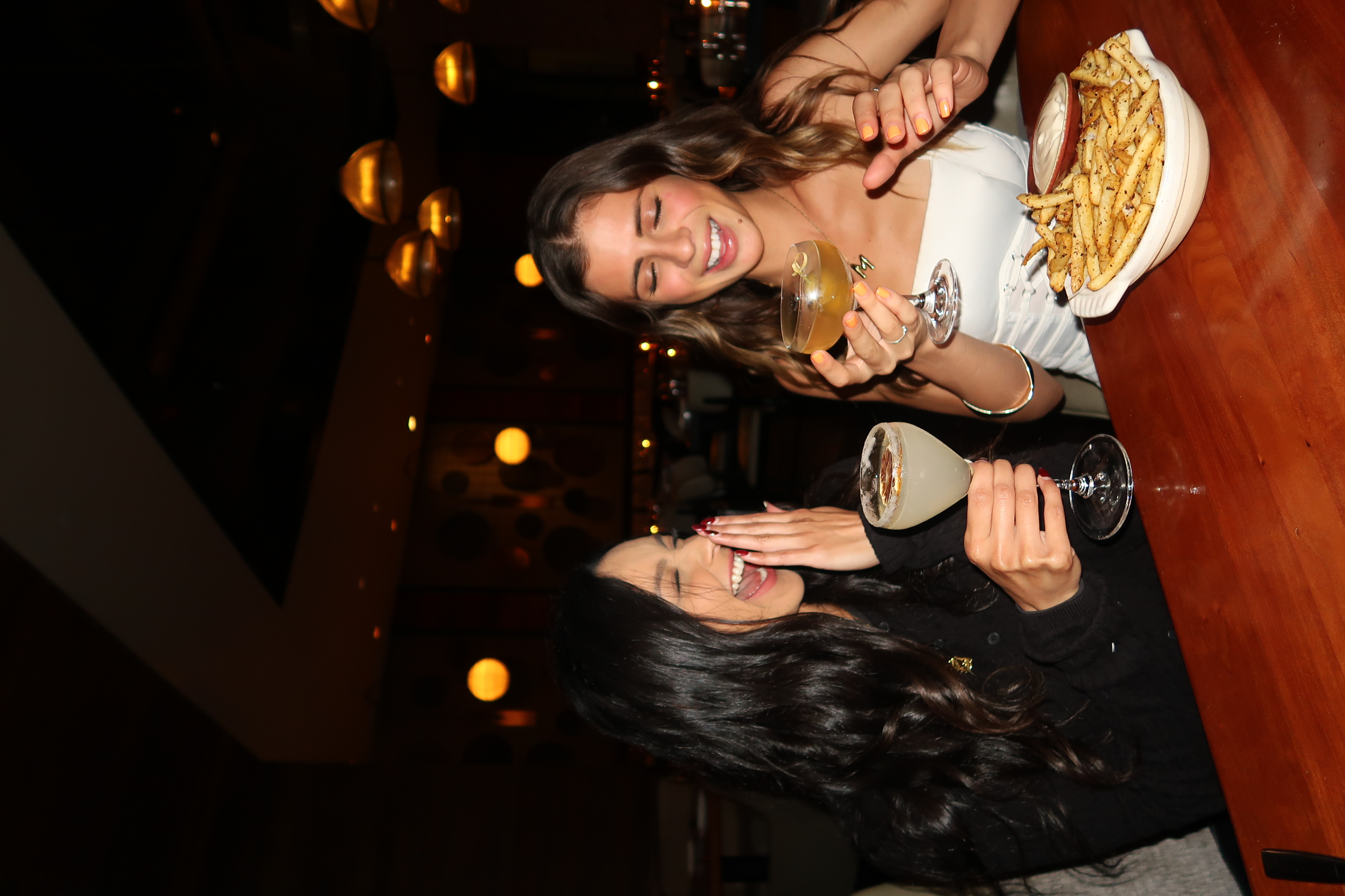 Martini cocktails and fresh seafood dishes at Lionfish in Downtown San Diego Gaslamp with sushi and oysters on display