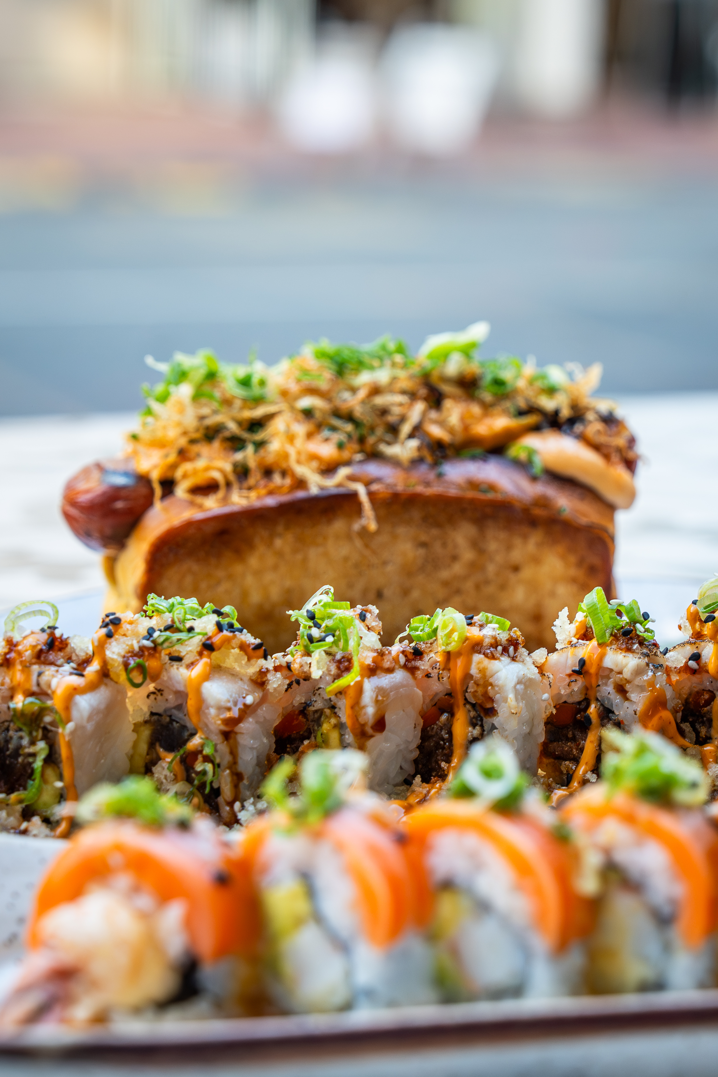 Happy hour at Lionfish in Downtown San Diego featuring fresh seafood, sushi rolls, and cocktails in a lively Gaslamp restaurant setting