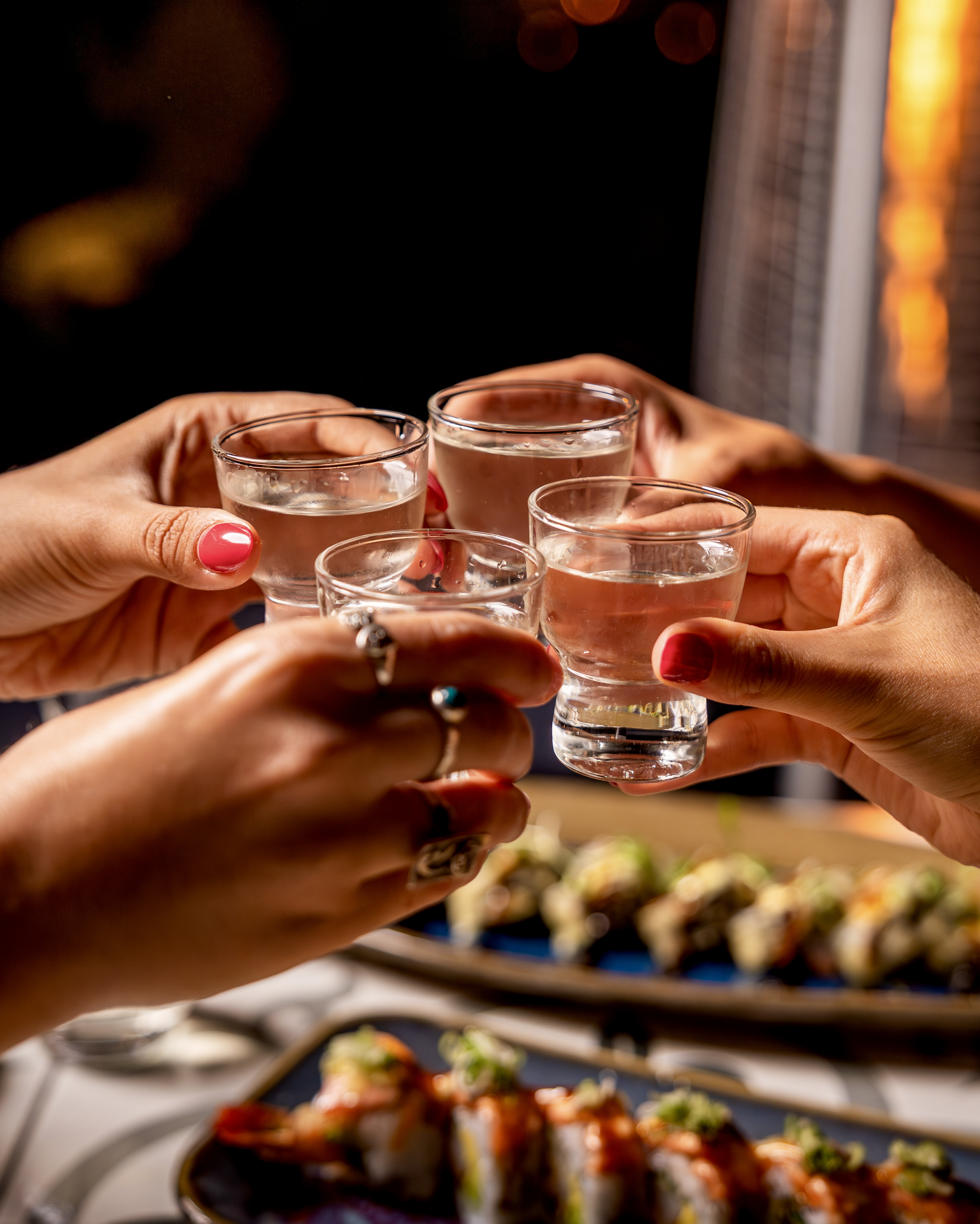 toasting with sake shots at Lionfish Downtown San Diego