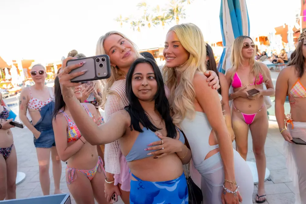 Bachelorette party group at a pool cabana at Tailgate Beach Club, Las Vegas