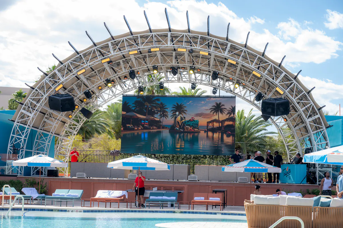 Stage arch and giant screen over the pool at Tailgate Beach Club