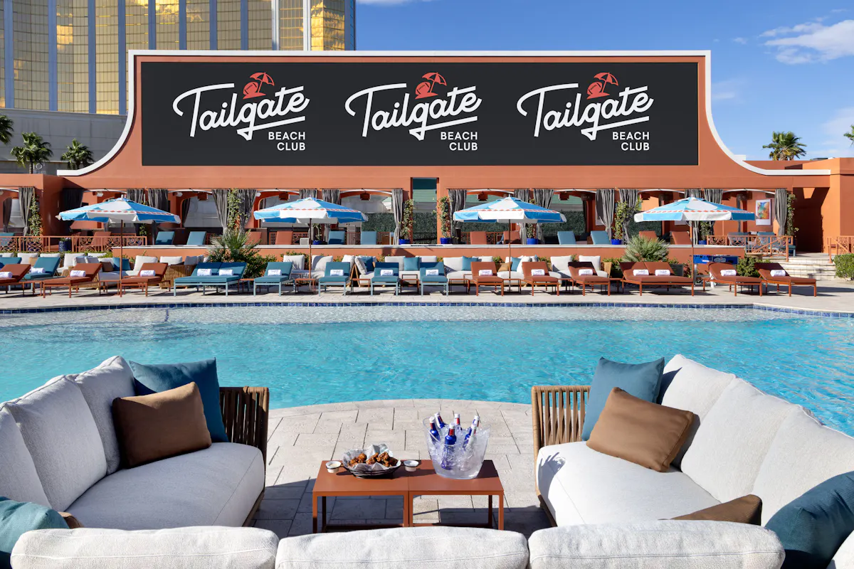 White daybed couches with triple Tailgate signage