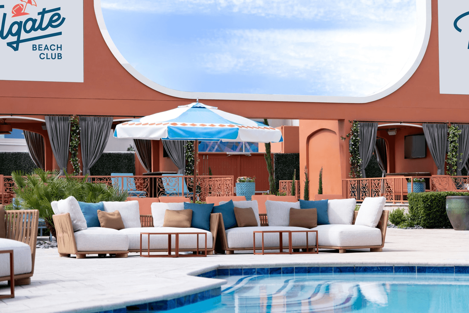 Curved daybeds and screens on the Tailgate Beach Club deck