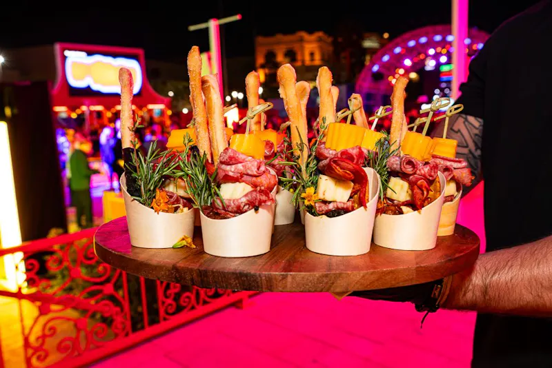 Individual canape cups arranged on a serving board