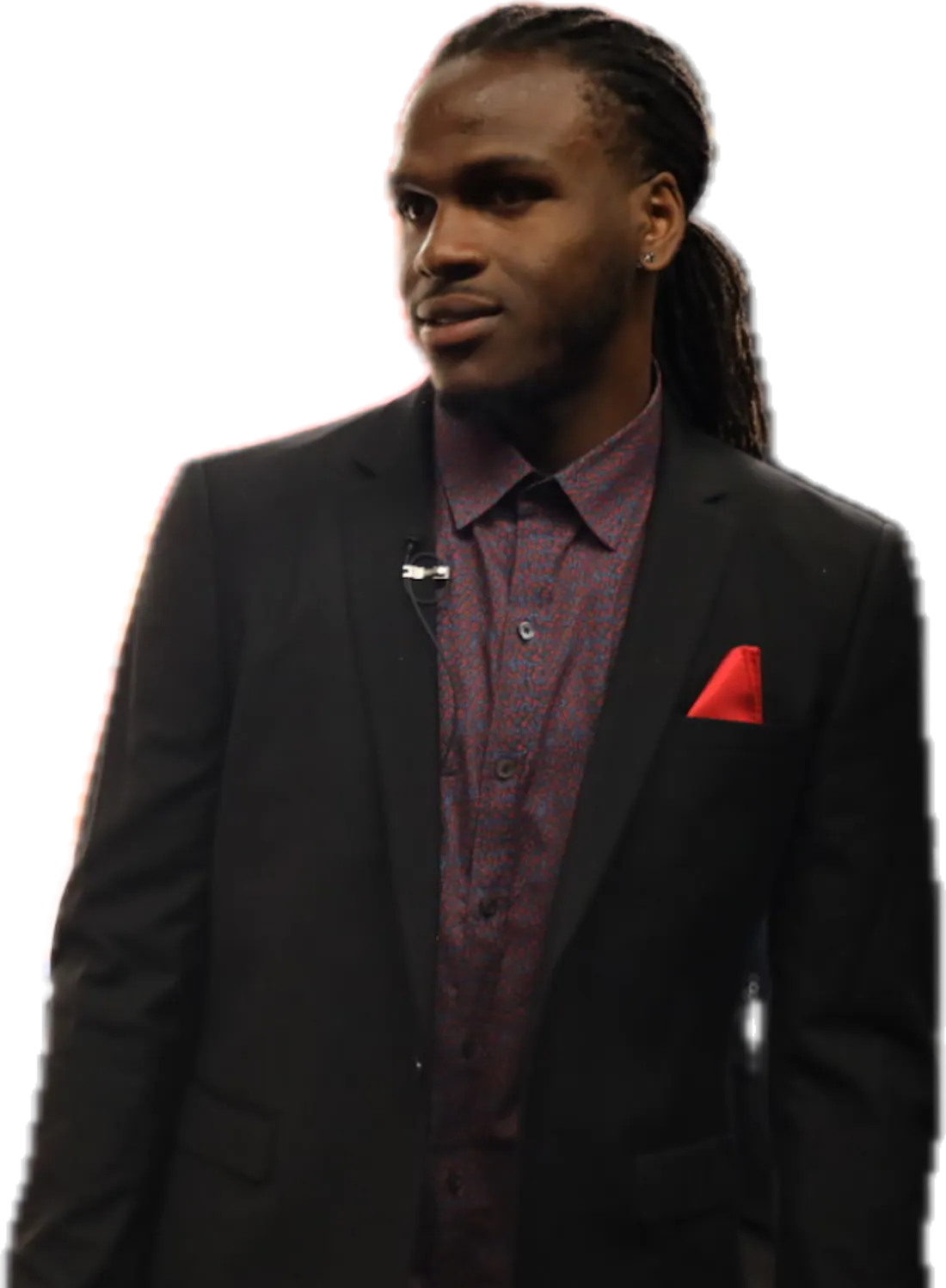 Jamaal Charles in a black suit with a red pocket square