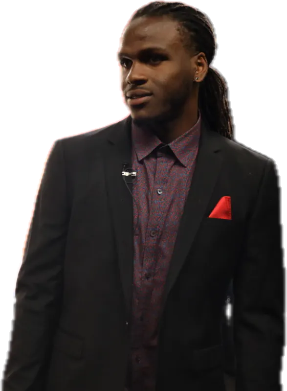 Jamaal Charles in a black suit with a red pocket square