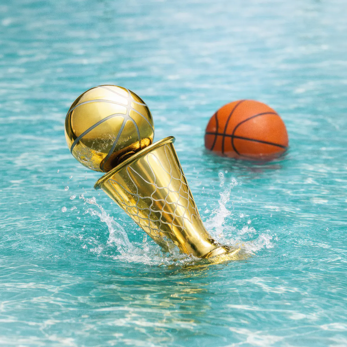 Gold trophy and basketball splashing in pool at Tailgate Beach Club