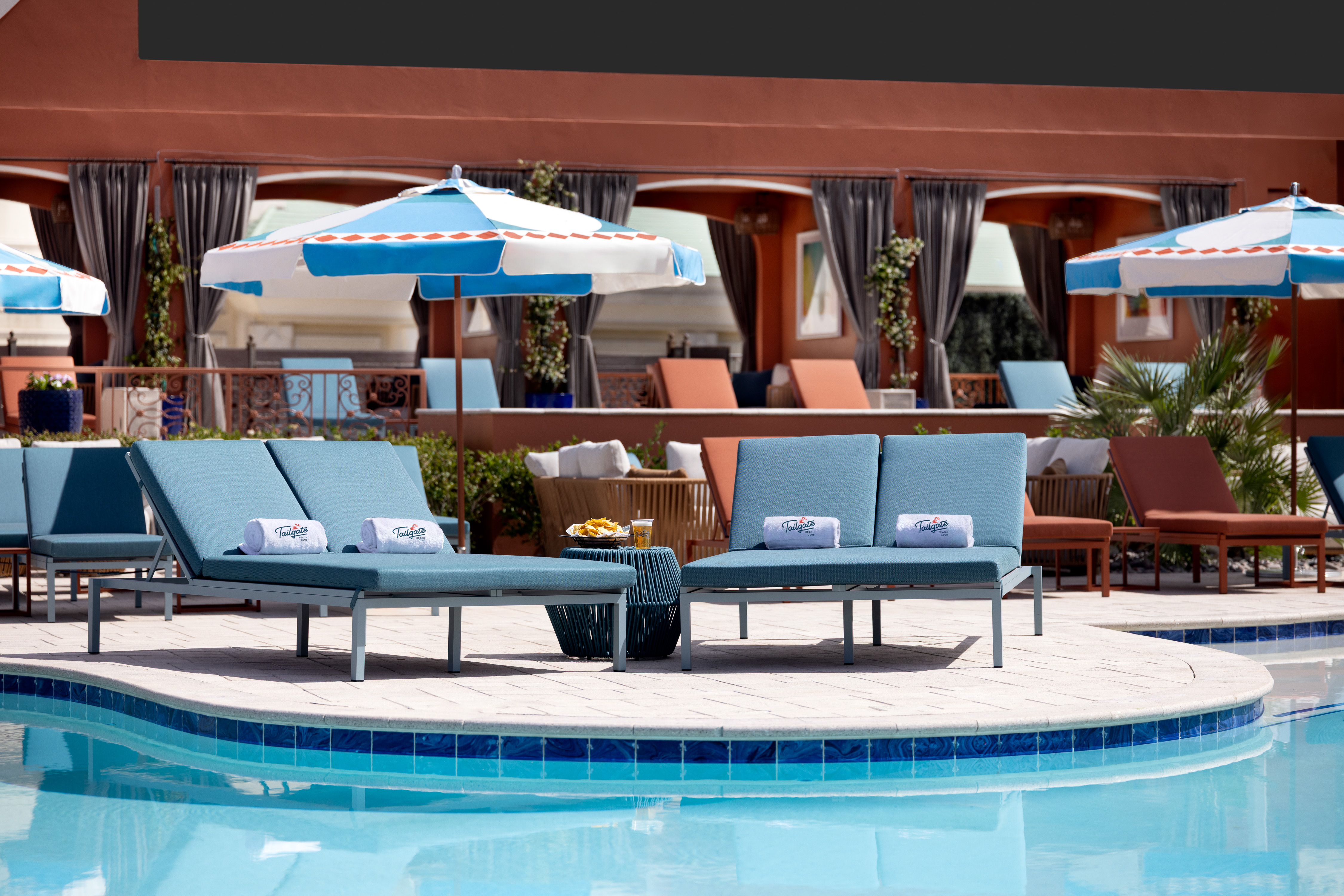 Tailgate Beach Club lounge chairs at a pool party and beach club