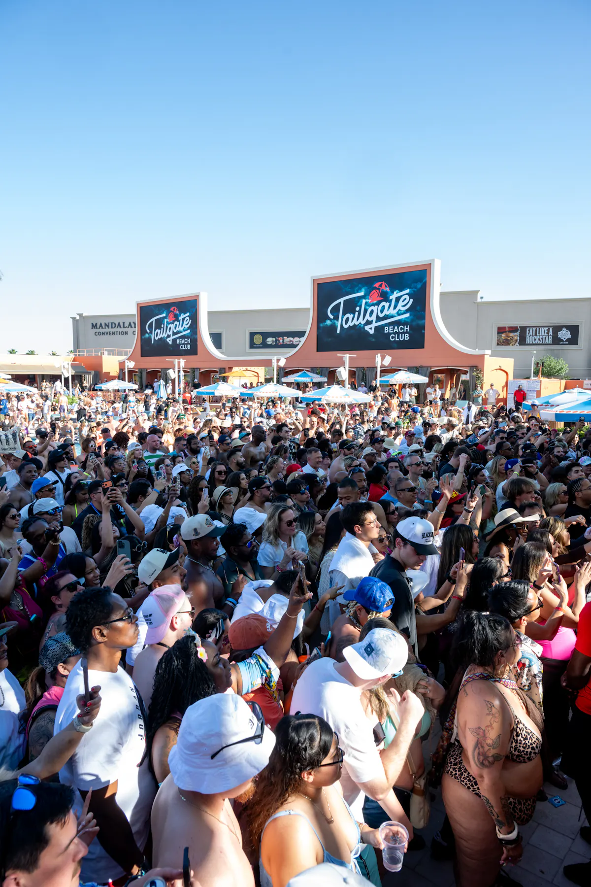 Massive wide crowd with Tailgate marquee, shows scale