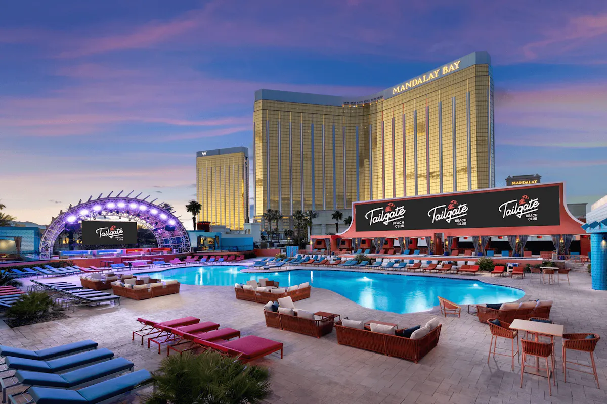 Dusk venue aerial with lit LED arch and Mandalay Bay at Tailgate Beach Club