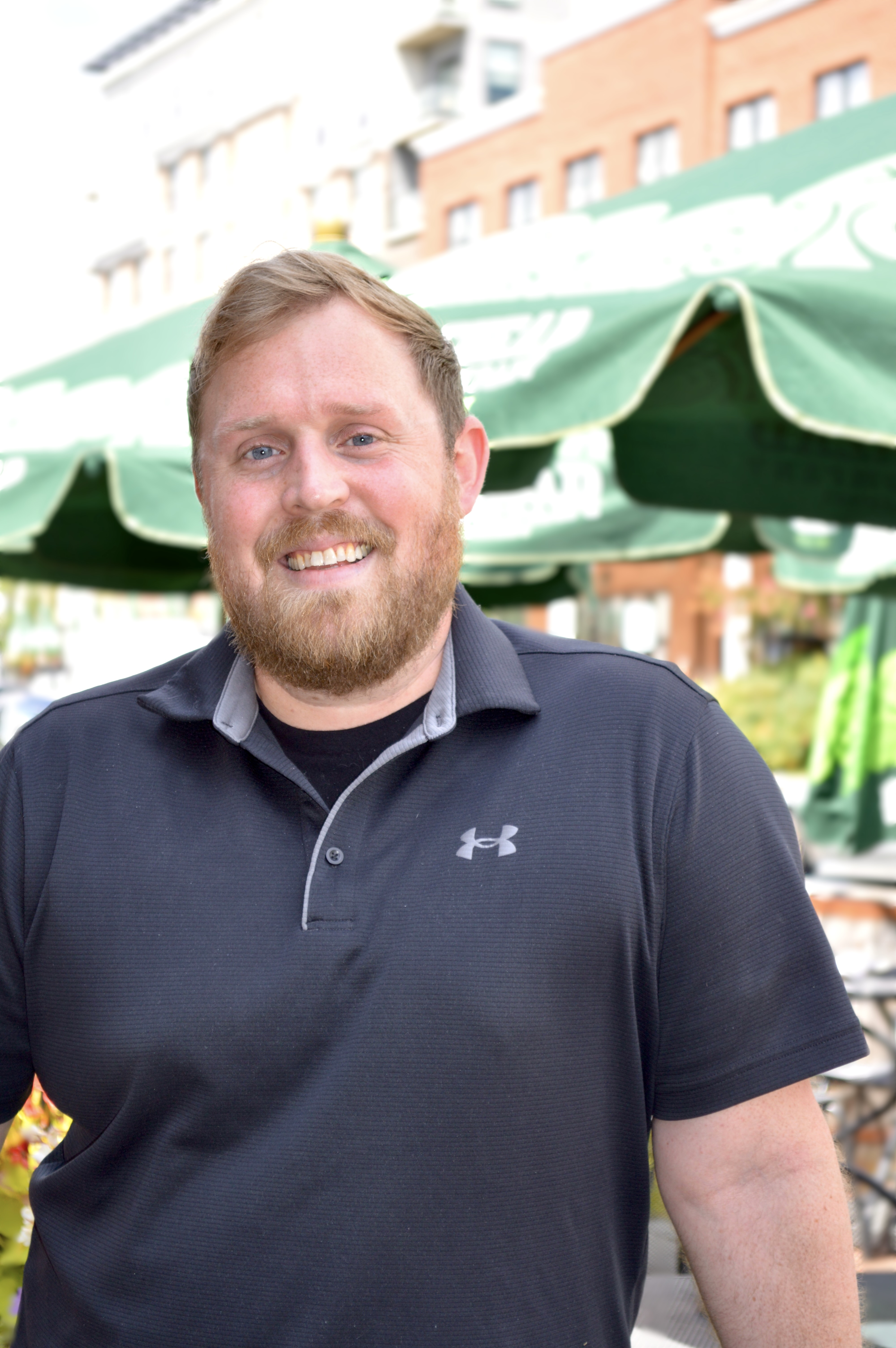 a man standing in front of a building
