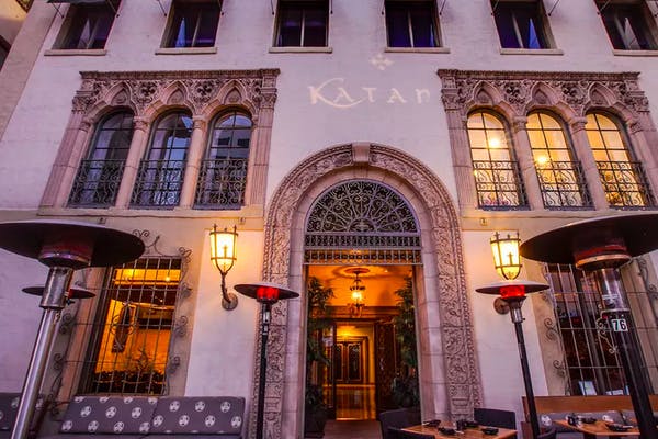 a clock sitting in front of a building