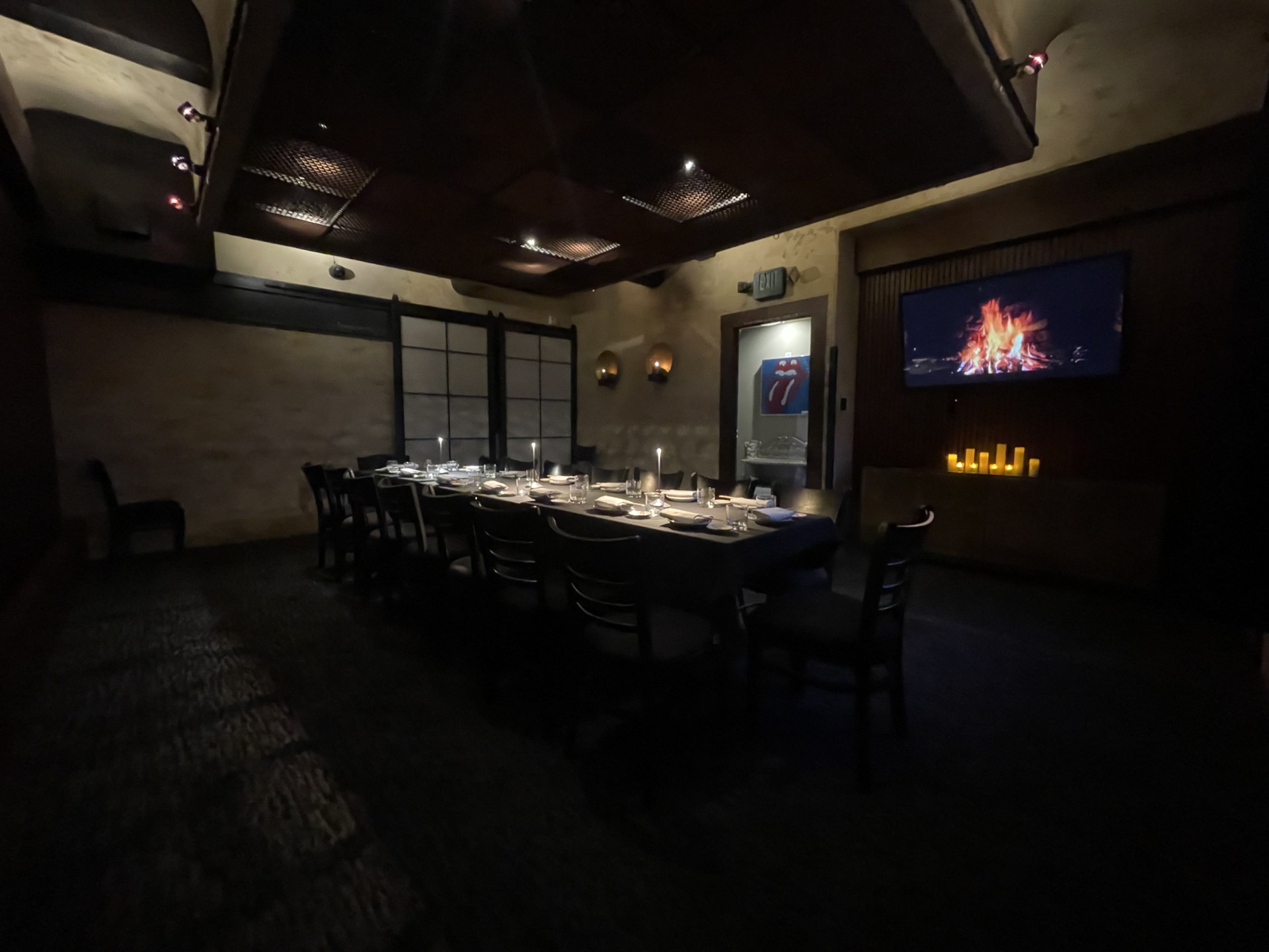 a room with a table set for dinner