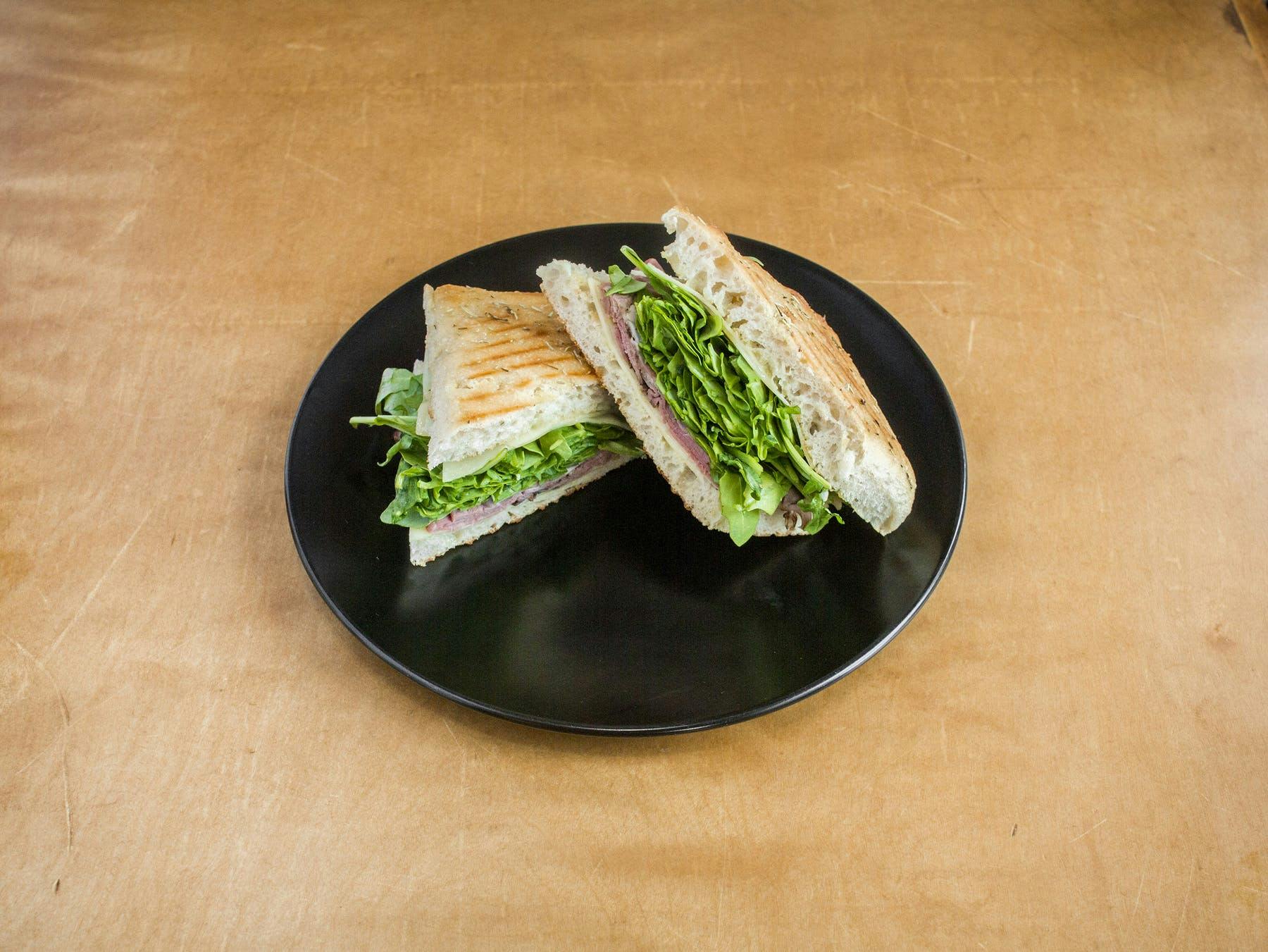 a sandwich cut in half on a plate