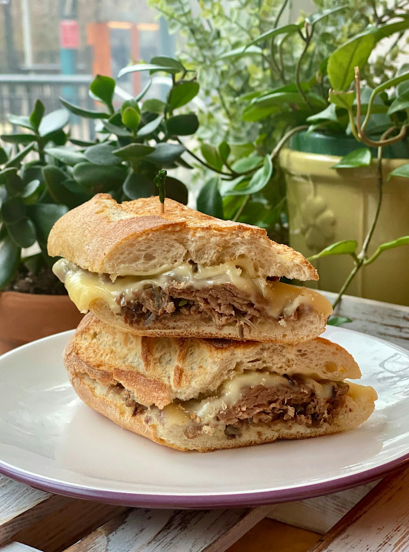 a sandwich cut in half on a plate