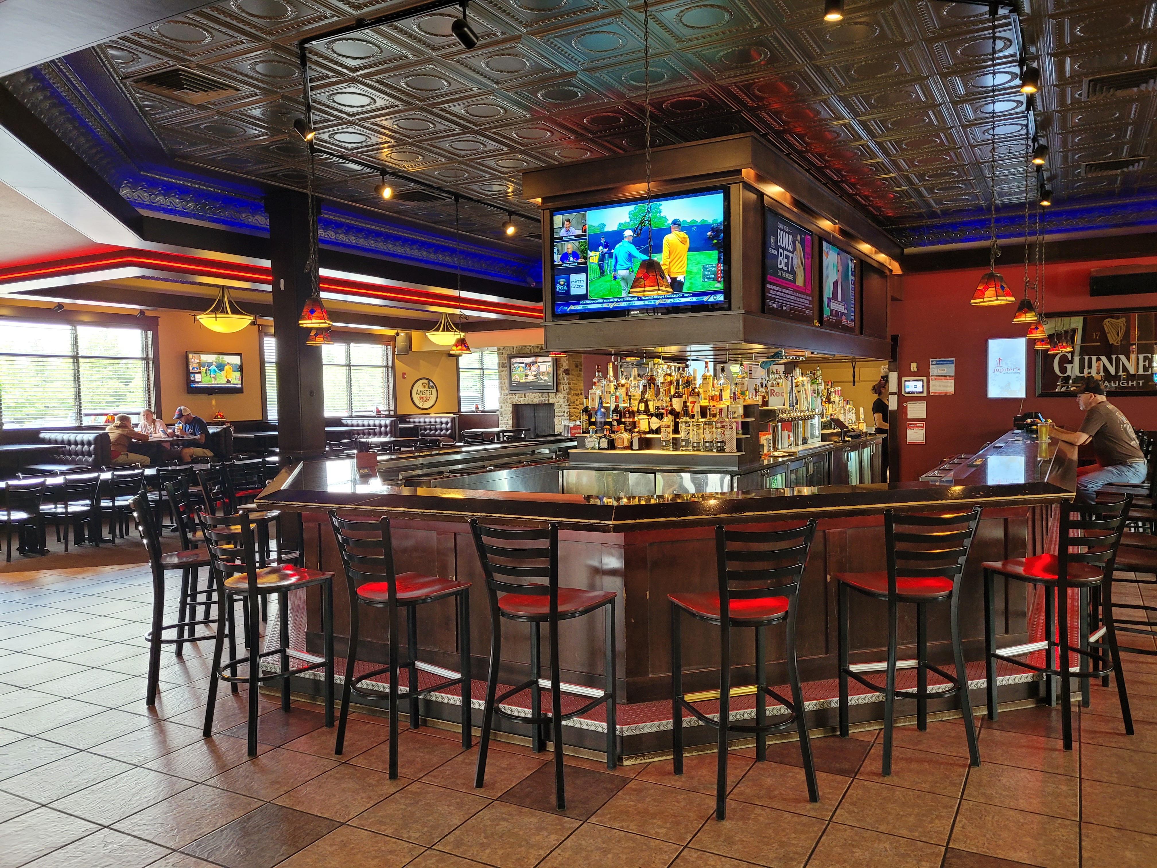 a group of people sitting at a table in a restaurant