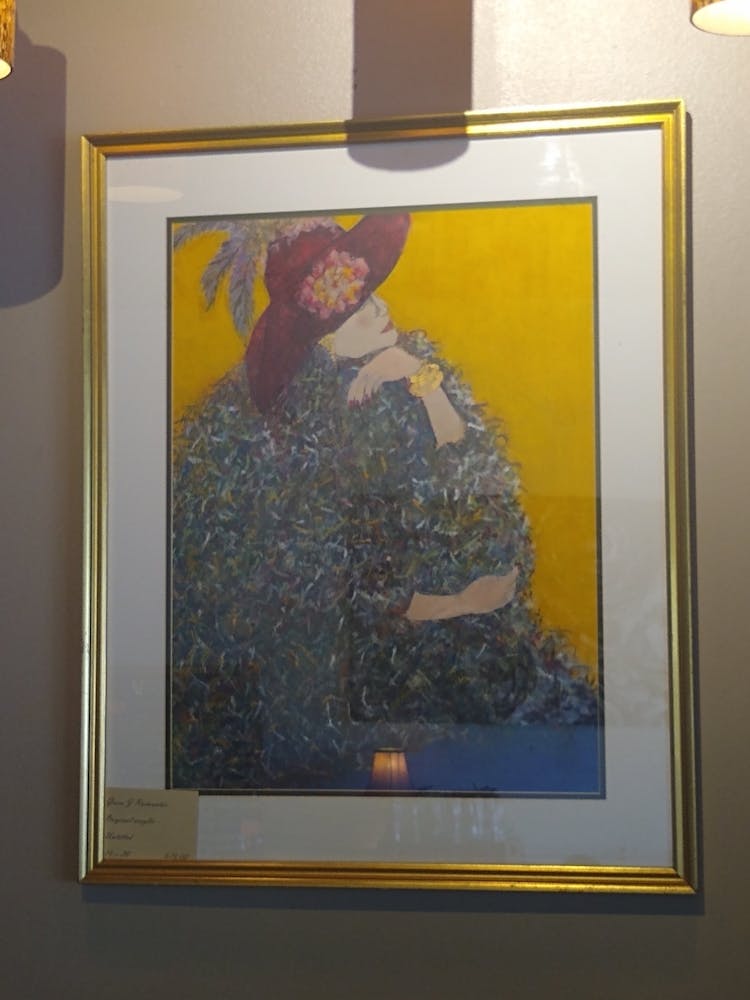 a painting hanging on a wall