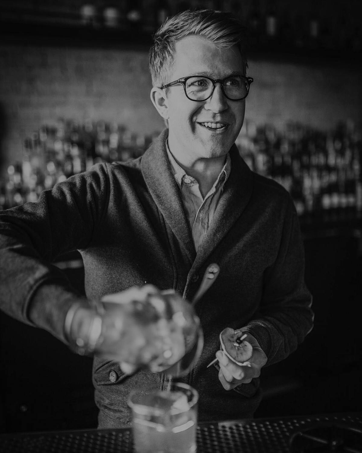 a man holding a cup