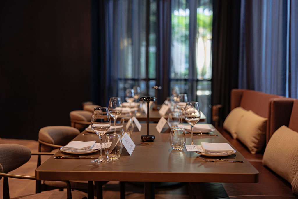 a dining room table filled with wine glasses