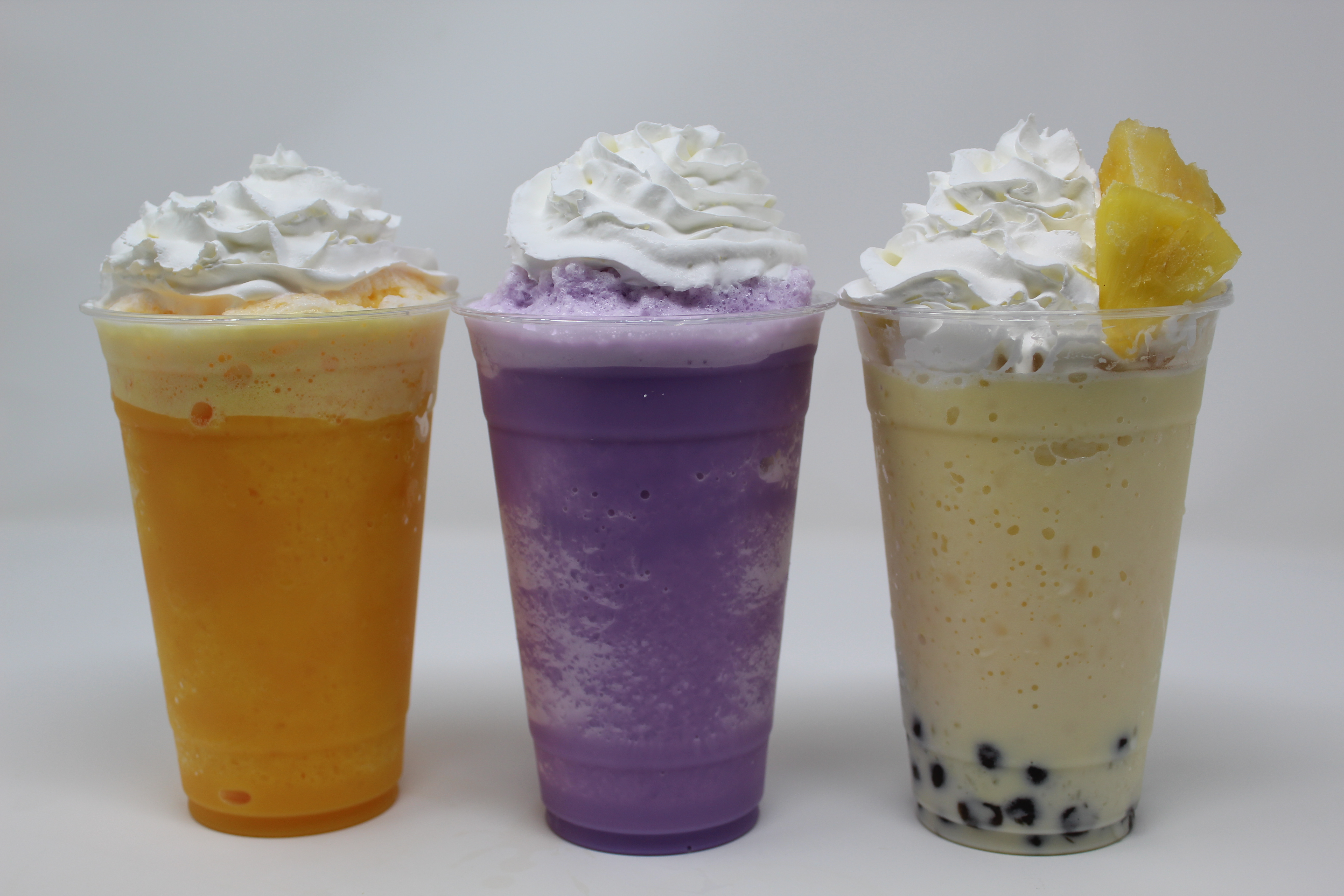 a glass of orange juice next to a cup of coffee