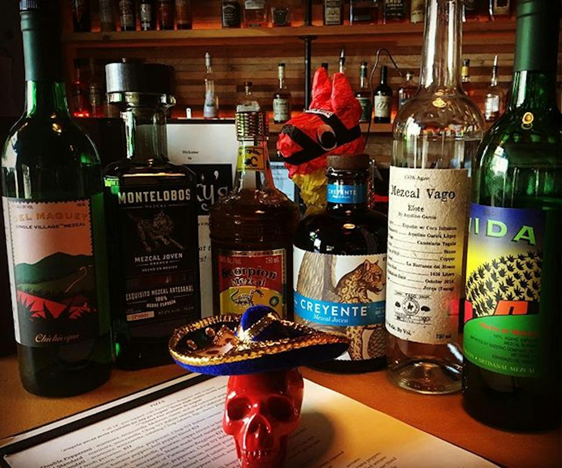 A red skull, and an array of different liquors