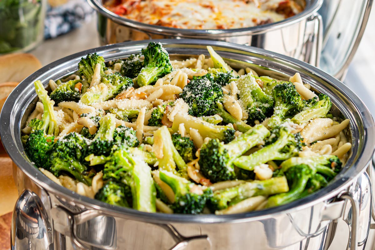 a bowl of food with broccoli