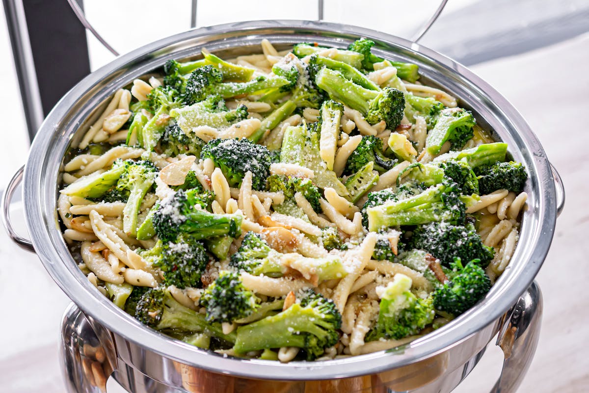 a bowl of food with broccoli